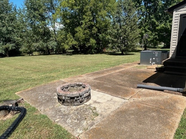 view of yard with an outdoor fire pit