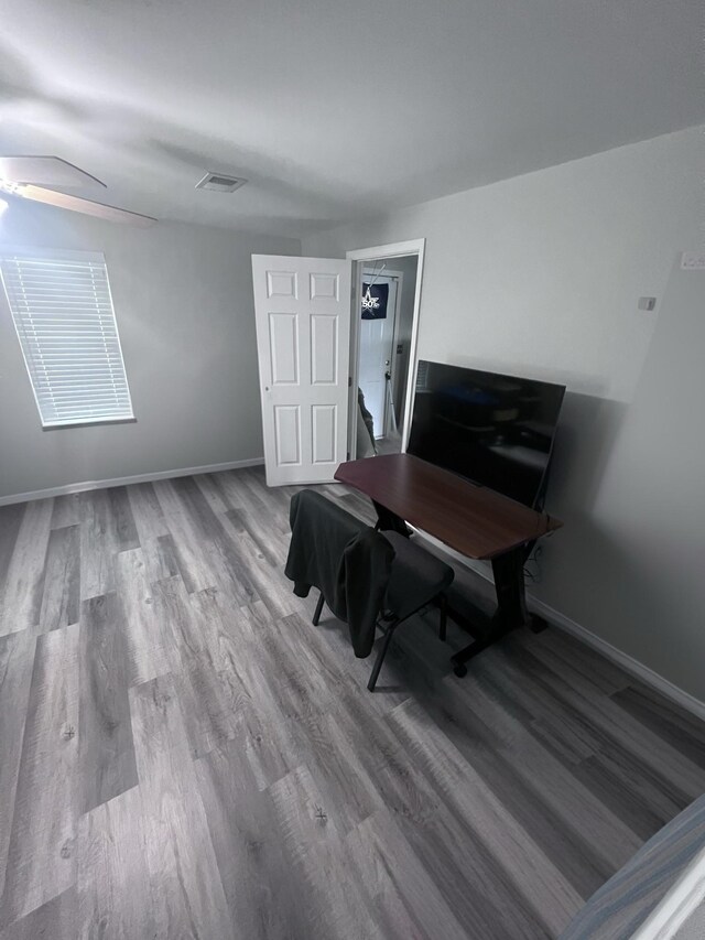 office space featuring hardwood / wood-style floors and ceiling fan