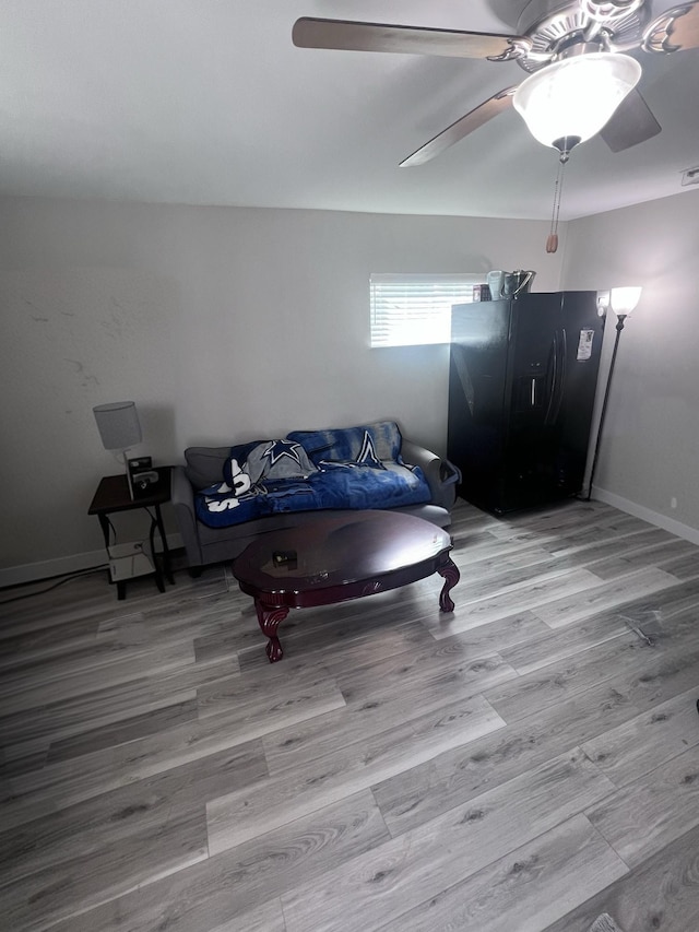 game room with wood finished floors and baseboards