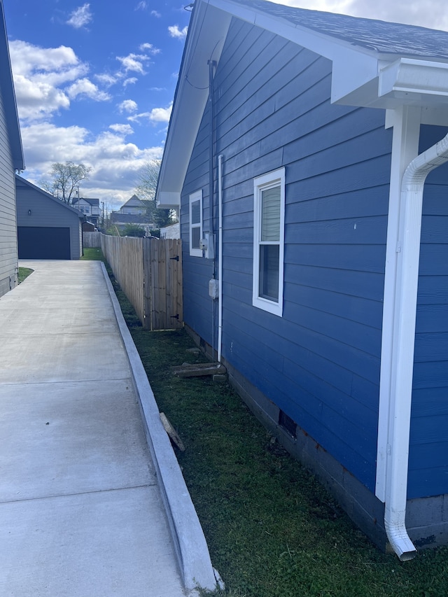 view of side of property featuring a garage