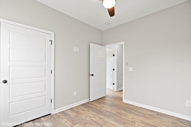 unfurnished bedroom with light hardwood / wood-style flooring and ceiling fan