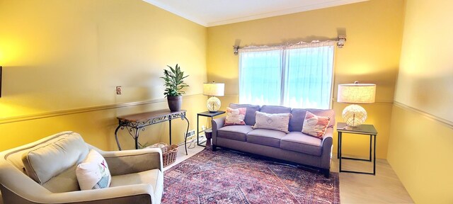 living room with crown molding and wood finished floors