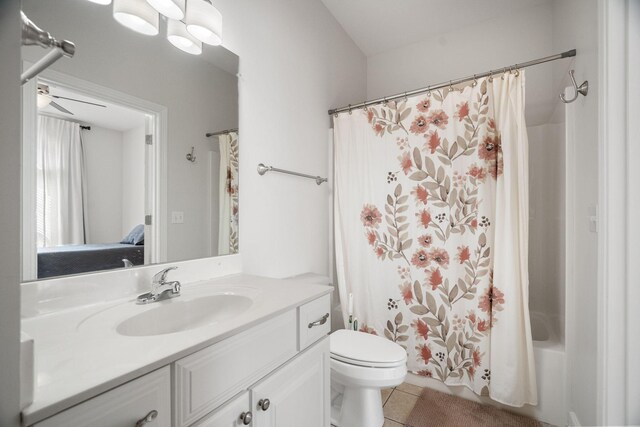 full bathroom with tile patterned floors, vanity, ceiling fan, toilet, and shower / bathtub combination with curtain