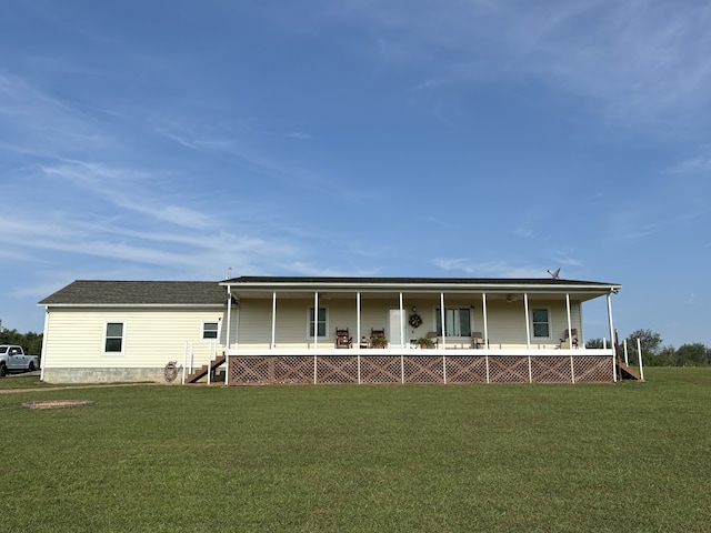 back of property featuring a porch and a lawn