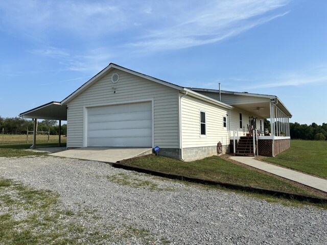 view of property exterior featuring a garage, a yard, and a carport