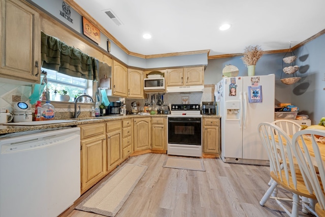 kitchen with ornamental molding, white appliances, decorative backsplash, and light hardwood / wood-style floors