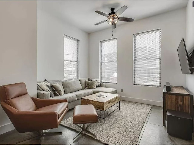 sitting room featuring a wealth of natural light and ceiling fan