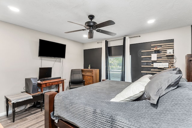 bedroom featuring ceiling fan and light wood-type flooring