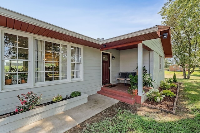 doorway to property with a porch