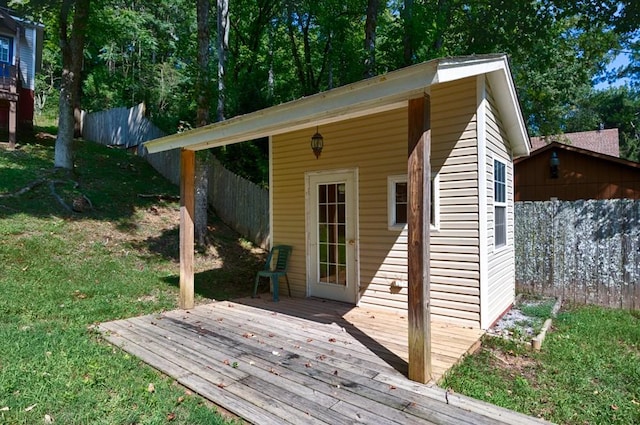 deck with a lawn and fence