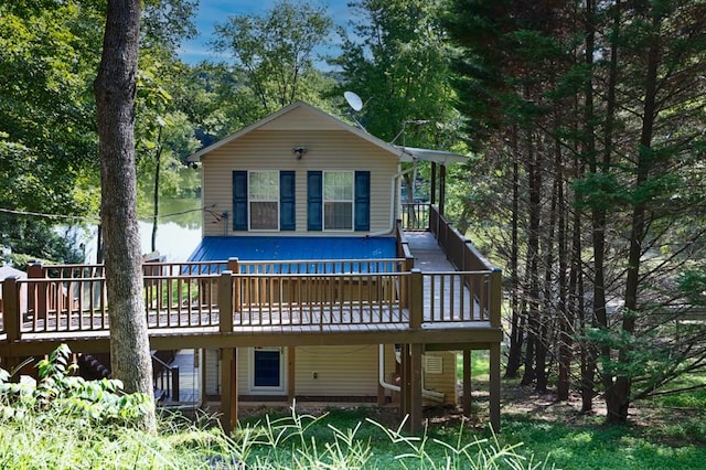 back of property featuring a wooden deck