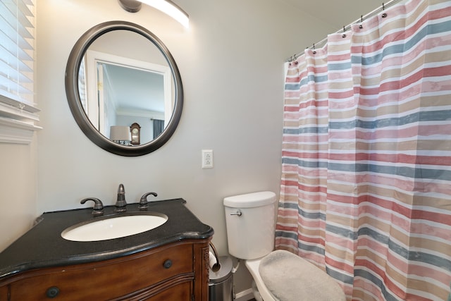 bathroom with vanity, toilet, and a shower with curtain