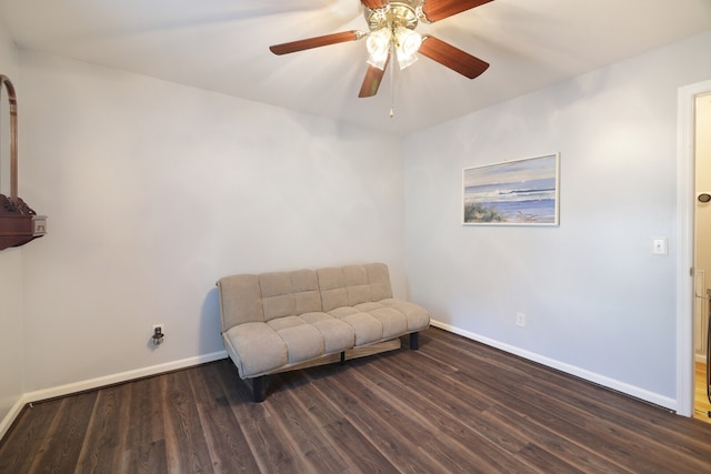 sitting room with ceiling fan and dark hardwood / wood-style floors