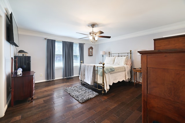 bedroom with crown molding, ceiling fan, and dark hardwood / wood-style floors