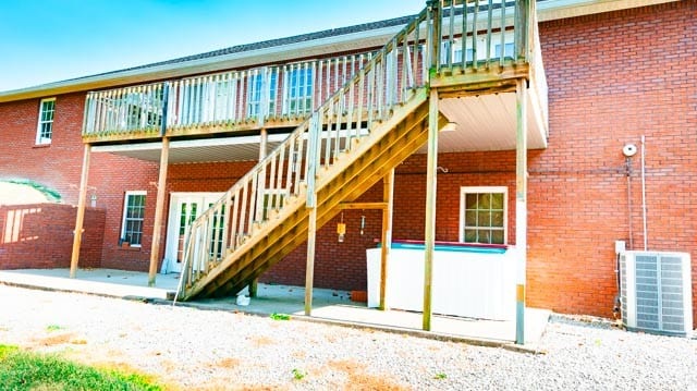 rear view of house with central AC