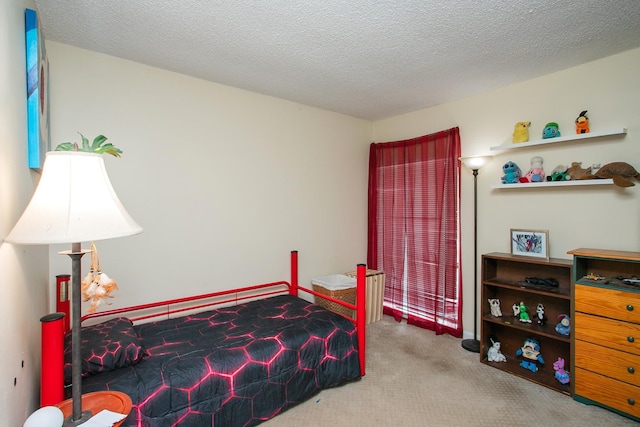 carpeted bedroom with a textured ceiling