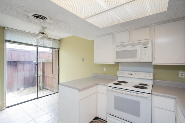 kitchen with ceiling fan, white cabinets, kitchen peninsula, light tile patterned flooring, and white appliances