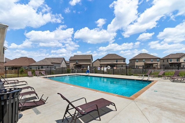 view of swimming pool with a patio area