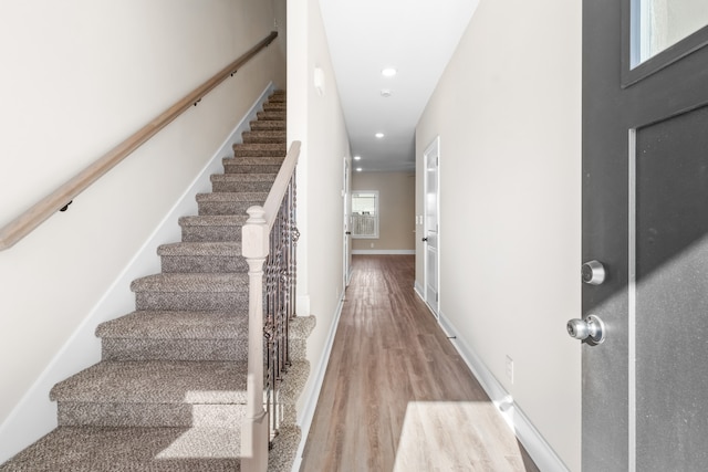 foyer entrance with hardwood / wood-style floors