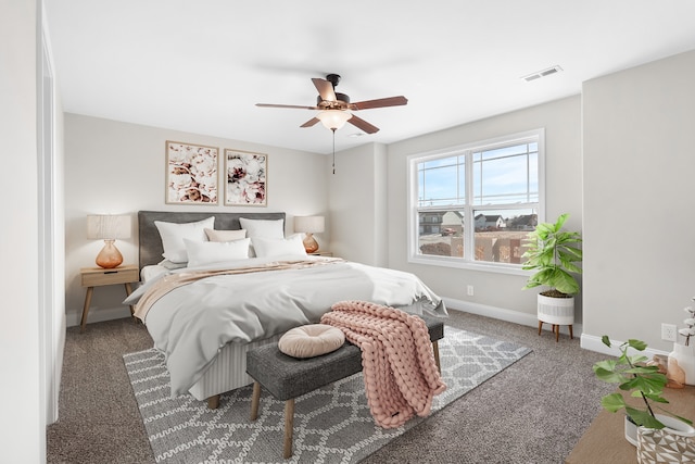 carpeted bedroom featuring baseboards, visible vents, and a ceiling fan