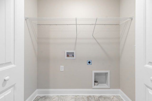 laundry room with marble finish floor, hookup for a washing machine, laundry area, and hookup for an electric dryer