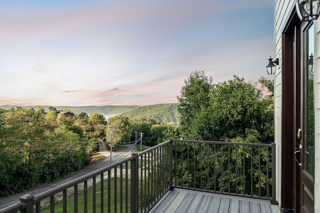 view of balcony at dusk