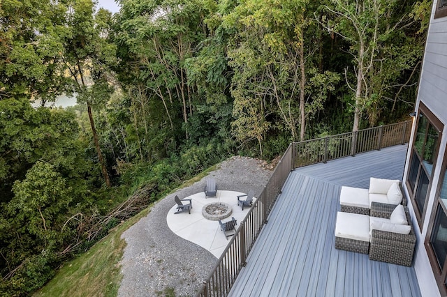 deck featuring an outdoor fire pit