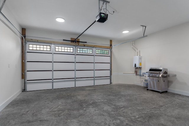 garage with tankless water heater and a garage door opener