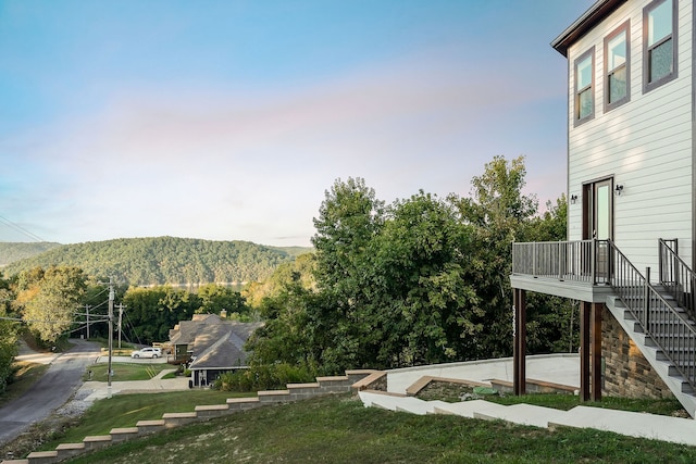 view of yard featuring a mountain view and a patio area