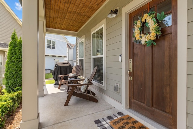 view of exterior entry with covered porch