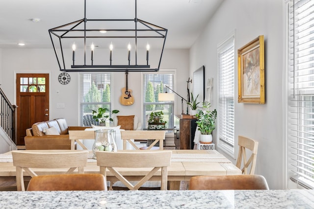 dining area featuring an inviting chandelier