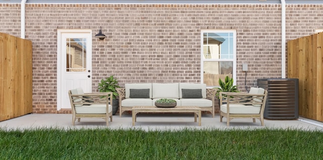 view of patio featuring cooling unit, fence, and an outdoor living space