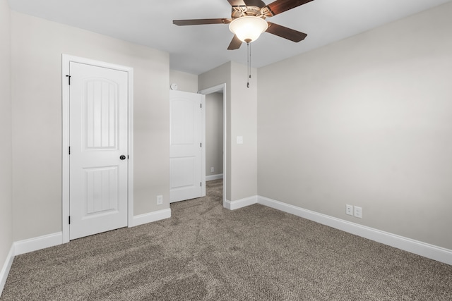 unfurnished bedroom featuring ceiling fan, carpet flooring, and baseboards