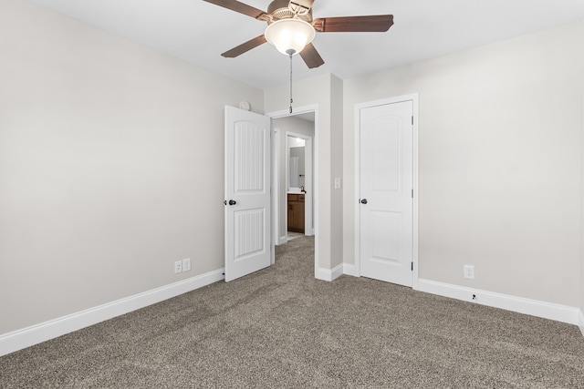 unfurnished bedroom featuring carpet floors, a ceiling fan, and baseboards