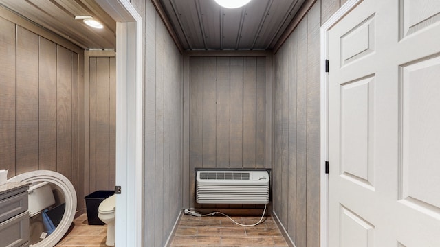 view of sauna with wood walls and wood-type flooring