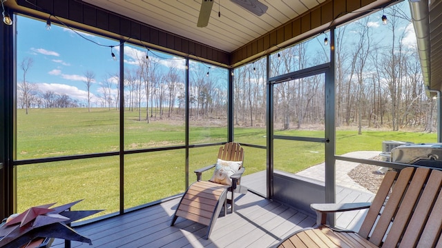 sunroom with ceiling fan and plenty of natural light