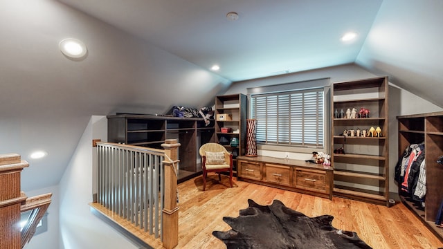 office area with vaulted ceiling and light hardwood / wood-style flooring