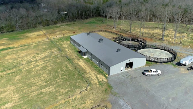 birds eye view of property with a rural view