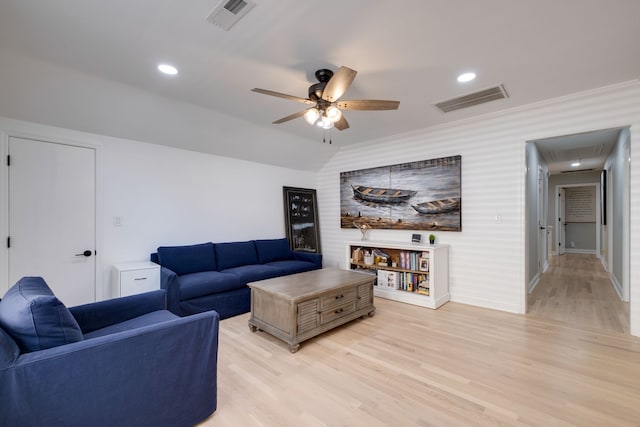 living room with ceiling fan and hardwood / wood-style flooring