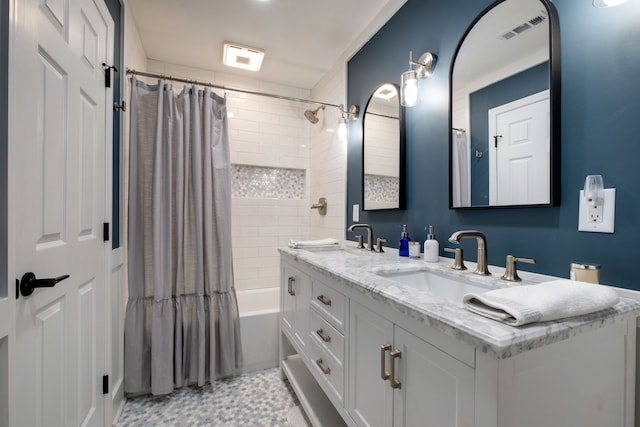 bathroom with tile patterned floors, shower / bath combination with curtain, and vanity