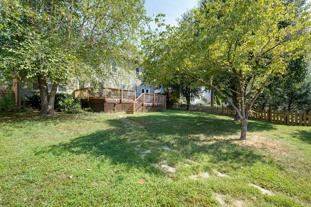 view of yard with a wooden deck