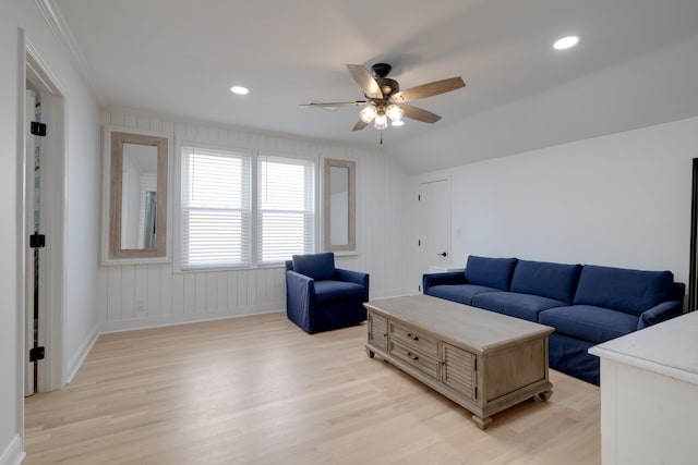 living room featuring ceiling fan and light hardwood / wood-style floors