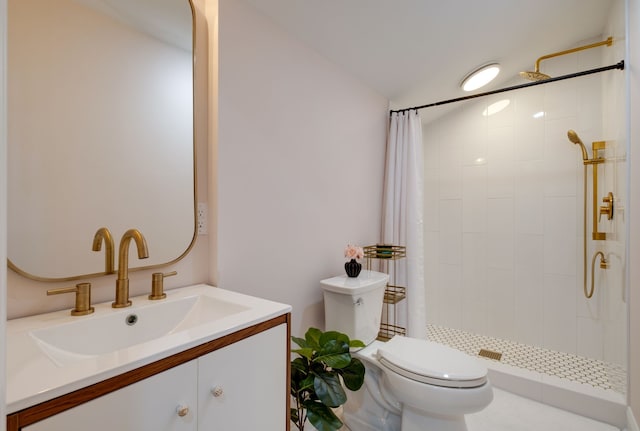 bathroom with toilet, a shower with shower curtain, and vanity