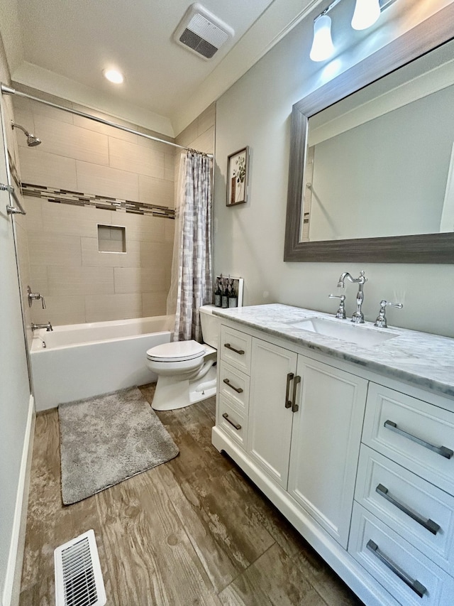 full bathroom with toilet, shower / tub combo, wood-type flooring, and vanity