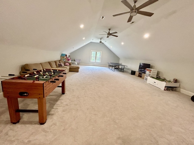 playroom featuring ceiling fan, vaulted ceiling, and light carpet