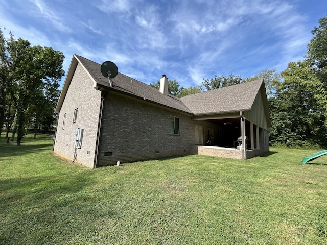 rear view of house with a yard