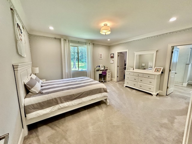 carpeted bedroom featuring ensuite bathroom