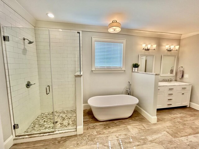 bathroom featuring independent shower and bath, crown molding, vanity, and tile patterned floors