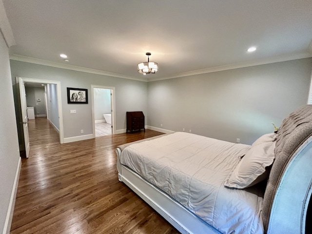 bedroom featuring a notable chandelier, connected bathroom, crown molding, and dark wood-type flooring