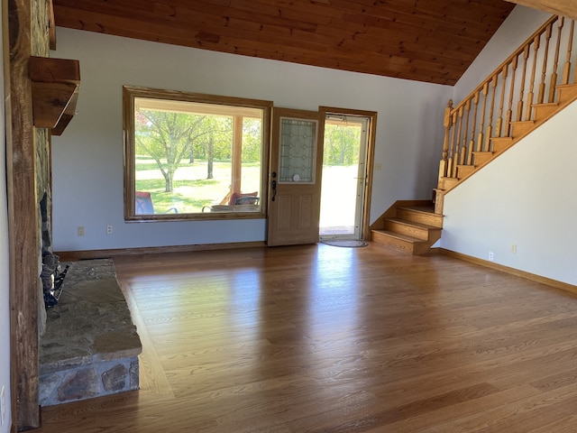 entrance foyer with wood ceiling, vaulted ceiling, and hardwood / wood-style floors